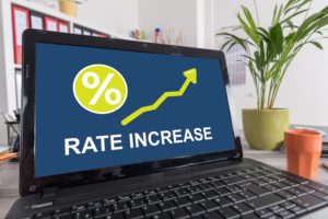 Laptop screen with rate increase concept