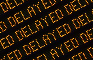 A Close Up Of The Word Delayed Repeated Multiple Times On A Sign At A Station Or Airport Or Highway