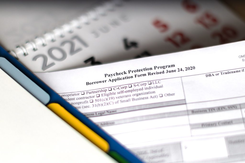 limited depth of field photo. selective focus photo of paycheck protection program borrower application form. paycheck protection program new round.