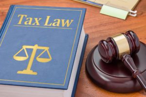 A law book with a gavel - Tax law