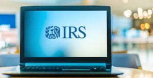 Laptop computer displaying logo of The Internal Revenue Service (IRS), the revenue service of the United States federal government