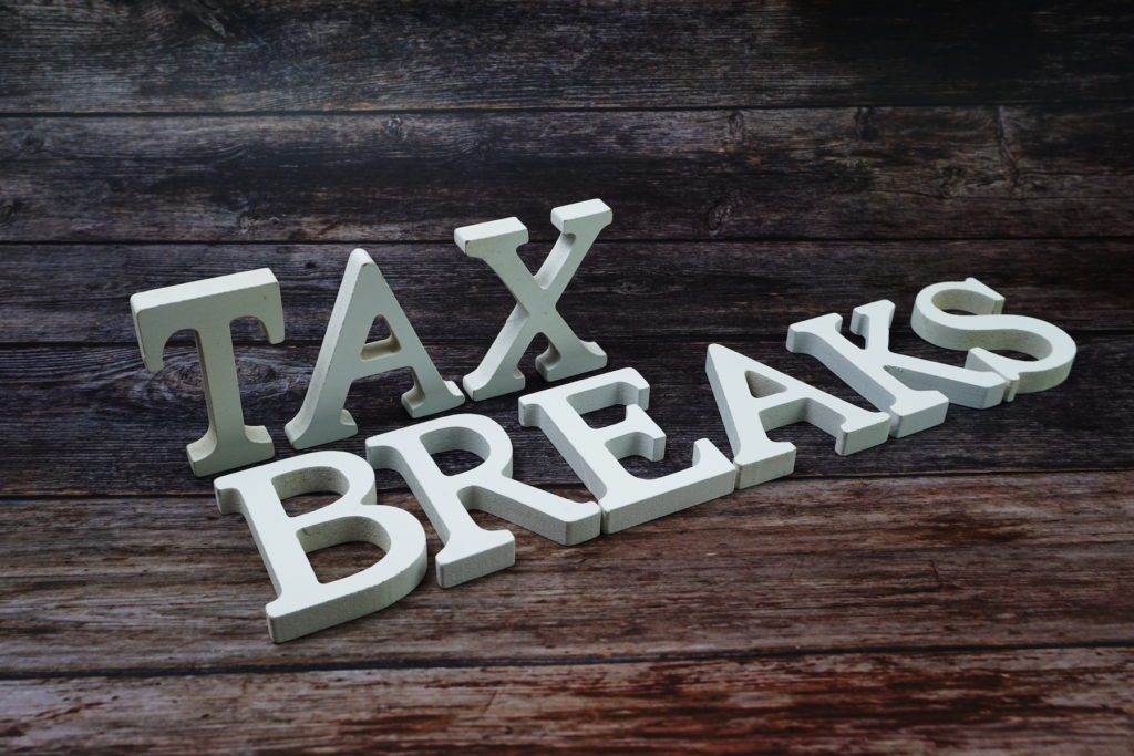 Tax Breaks Word alphabet letters on wooden background