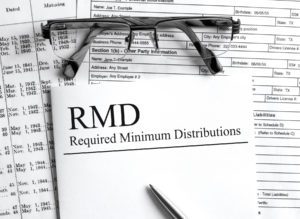 Paper with text RMD Required Minimum Distributions on a table