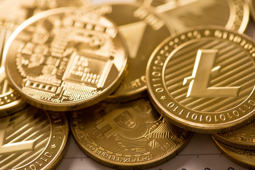 Cryptocurrency golden Bitcoin,Litecoin ,Ethereum coin selective focus on Litecoin, digital currency concept.