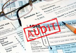 Tax forms with Audit stamped on them