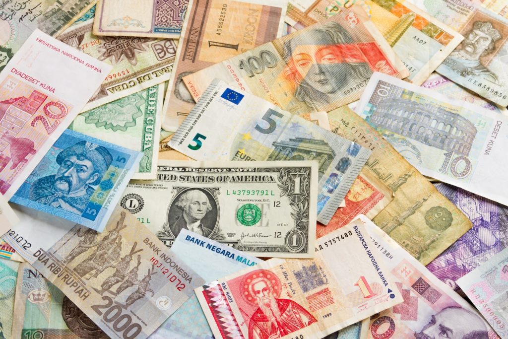 Colorful international money from all world pattern / background