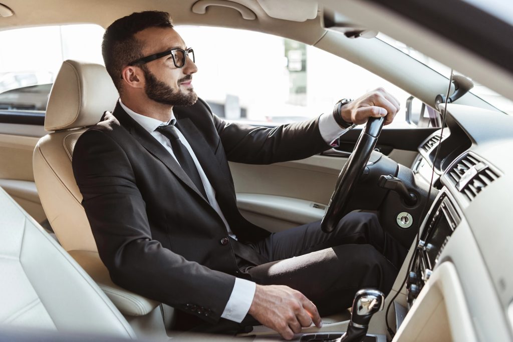 business man driving car