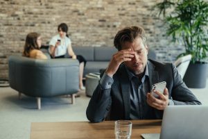 stressed man dealing with scam