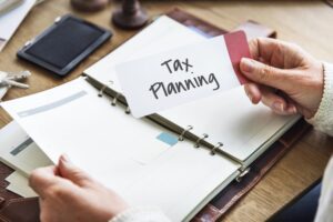 Woman holding Tax Planning reminder