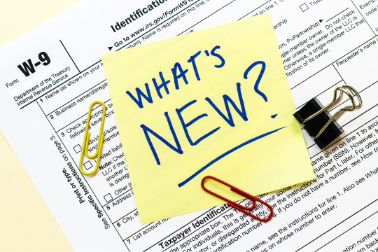 tax form with post it saying What's New?