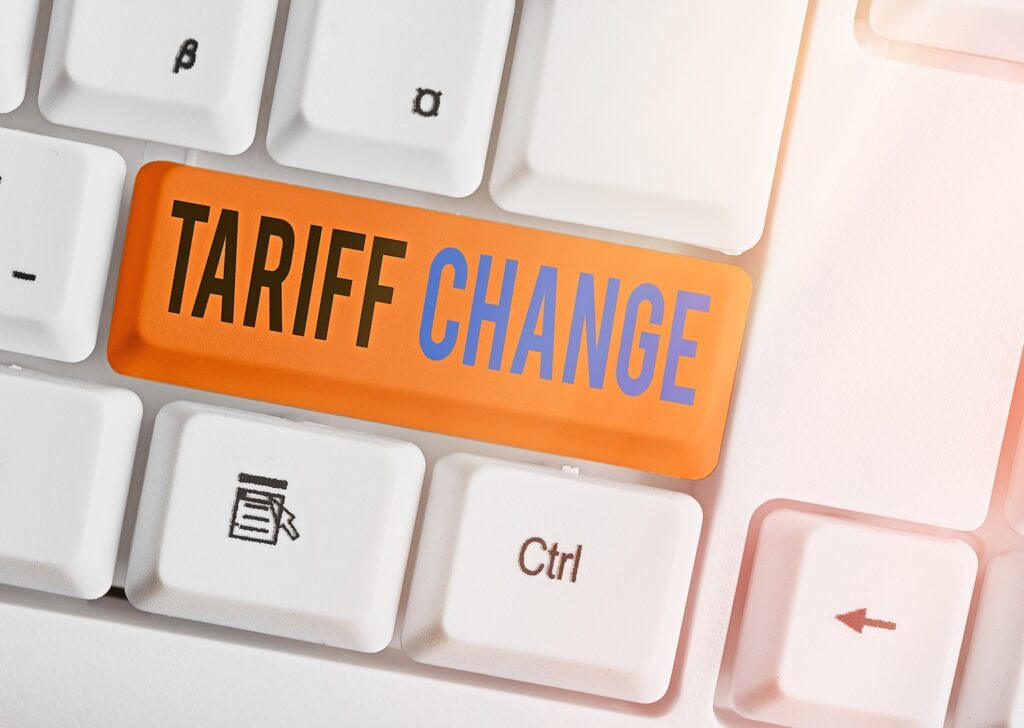 Writing note showing Tariff Change. Business concept for Amendment of Import Export taxes for goods and services