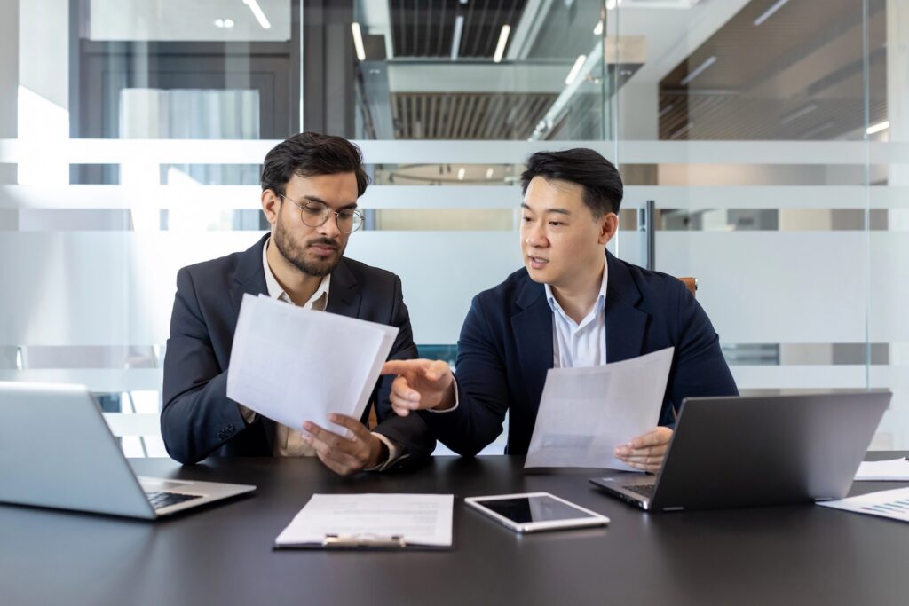Two business owners doing a mid-year analysis