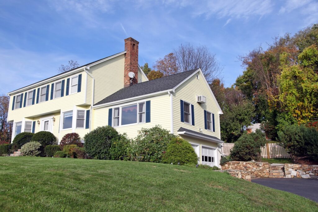 Yellow New England Style colonial house